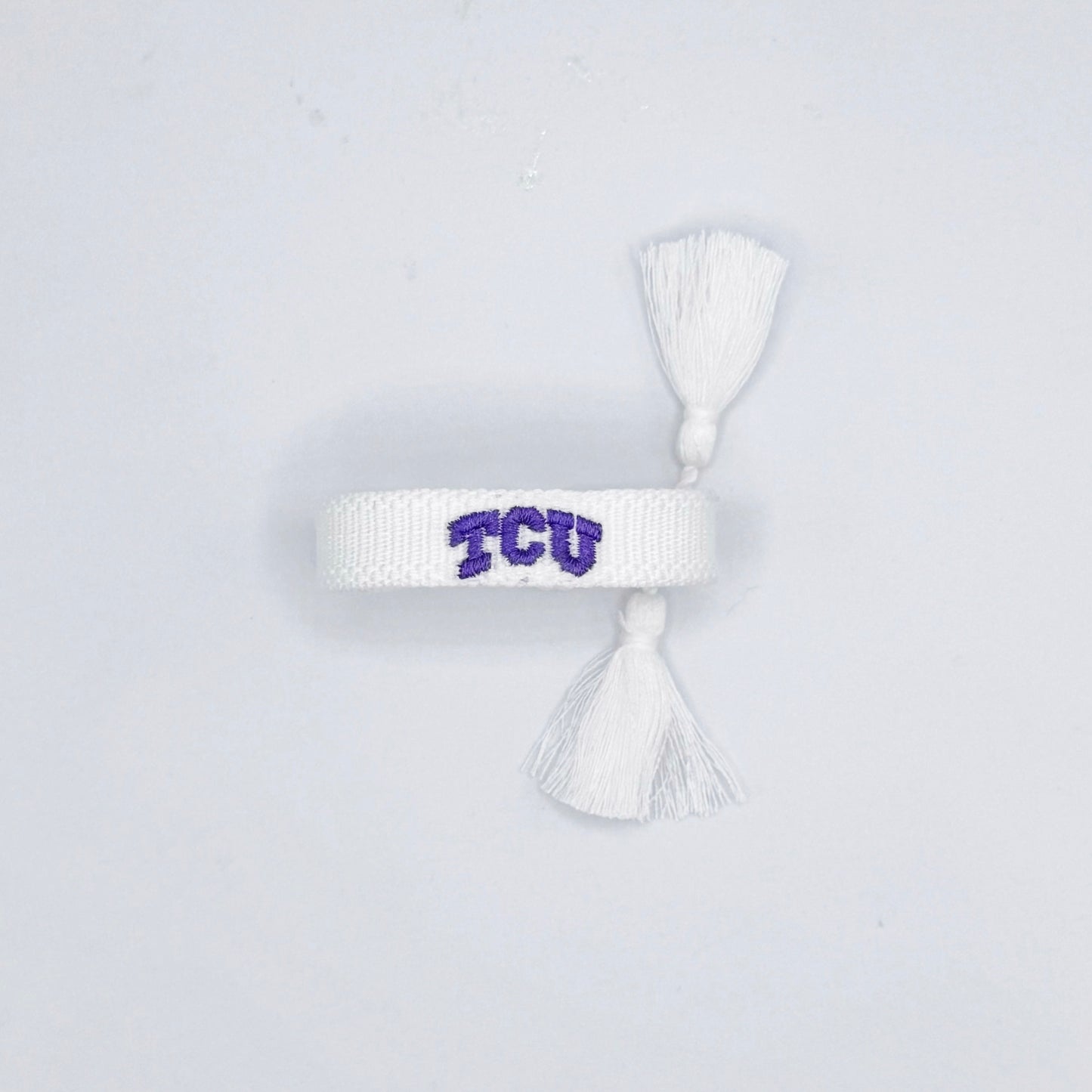 tiny TCU tassel bracelet